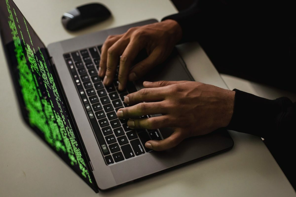 Someone typing on a laptop